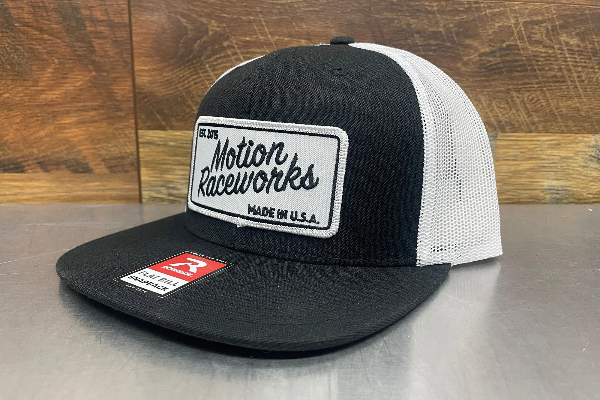 Motion Heritage Flat Bill Hat Black/White Snapback